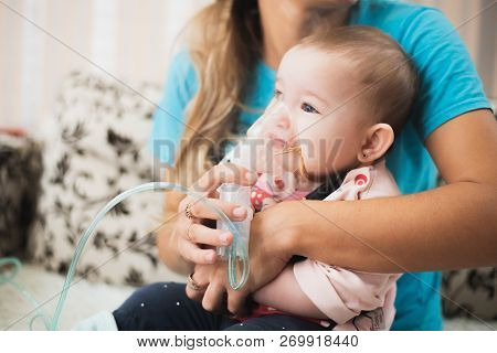 Mom Makes Inhalation Of The Child, Holding Hands