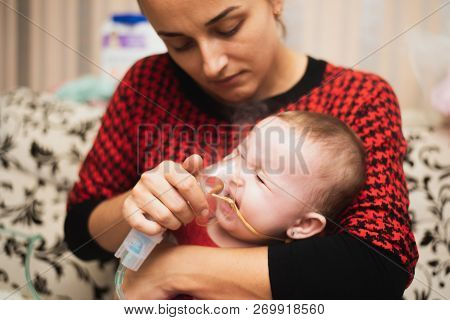 Mom Makes Inhalation Of The Child, Holding Hands