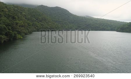 Aerial View Of Lake Bulusan In The Mountains With Green Rain Forest. Lake Hidden In The Jungle Mount