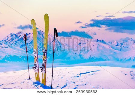 Ski in winter season, mountains and ski touring backcountry equipments on the top of snowy mountains in sunny day, Verbier Switzerland.