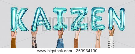Hands holding Kaizen word in balloon letters