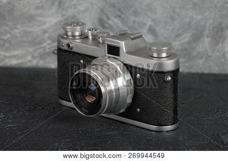 Moscow, Russia, February 06, 2018. The Old Film Camera Zarya, Brown Body, Released1961 On The Backgr