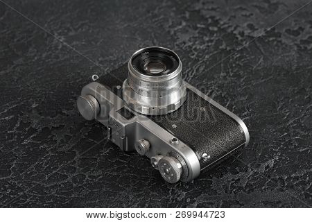 Moscow, Russia, February 06, 2018. The Old Film Camera Zarya, Brown Body, Released1961 On The Backgr