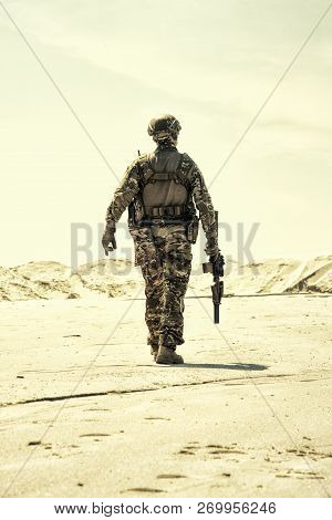 Army Infantryman Soldier With Rifle Desert Patrolling
