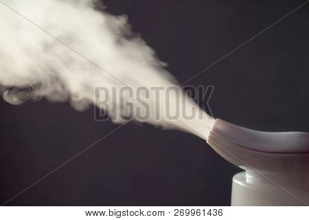 Ultra Sonic Humidifier Spreading Steam In Darkness