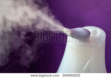 Ultra Sonic Humidifier Spreading Steam In Darkness