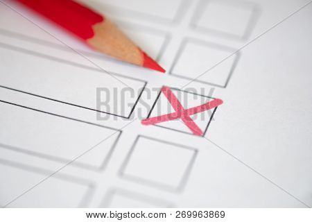 Close Up Voting Bulletin With Red Pencil. Concept Of Election. Photo With Shallow Depth Of Field