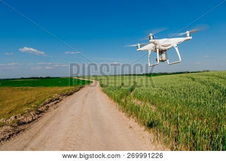 drone quad copter on green corn field