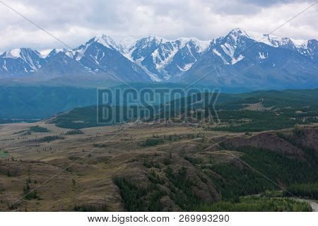 Kurai steppe and North-Chui ridge of Altai mountains, Russia. Cloud day.
