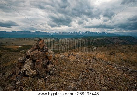 Kurai steppe and North-Chui ridge of Altai mountains, Russia. Cloud day.