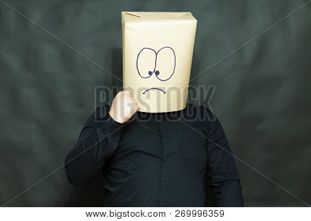 The Concept Of Emotions. A Man Shows His Interlocutor Fist. Facial Expression Reflects Determination