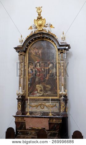 WURZBURG, GERMANY - JULY O4, 2018: The Beheading of Saint John the Baptist , Side altar in the Neumunster Collegiate Church in Wurzburg, Germany