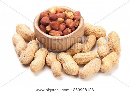 Roasted peanuts with peanut shells isolated on white background