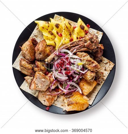 Lyulya Kebab, Shish Kebab, Grilled Salmon Fish, Onion And Pomegranate Grains On Black Plate Isolated