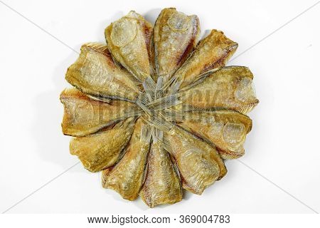 Dried Kradi Fish Fried In A Circular Pattern In White Background