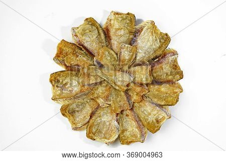 Dried Kradi Fish Fried In A Circular Pattern In White Background