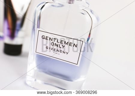 Perfume And Shower Gel For The Givenchy Brand With A Label. White Background. High Quality Photo.