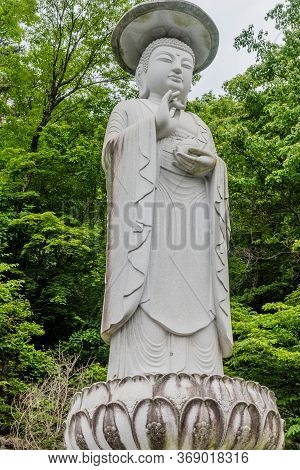 Haeinsa-gil, South Korea; May 26, 2020: Closeup Of Statue Of Standing Buddha Near Haeinsa Temple,