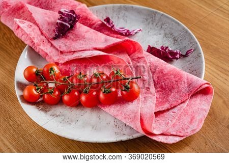 Lavash with tomatoes (soft, thin unleavened flatbread)