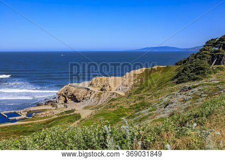 Ruins Of The Sutro Baths At Lands End Park, Cliffs With Pacific Cypress Trees And The Pacific Ocean 