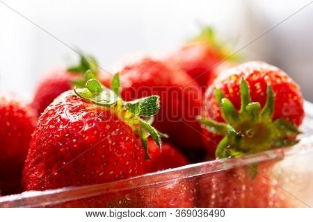 Strawberry Close-up In A Plastic Container. Fresh Juicy Flavored Strawberries In Selective Focus. Th