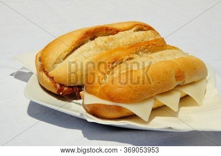Crusty Rolls With Cured Ham (jamon Serrano) And Manchego Cheese, Costa Del Sol, Malaga Province, And