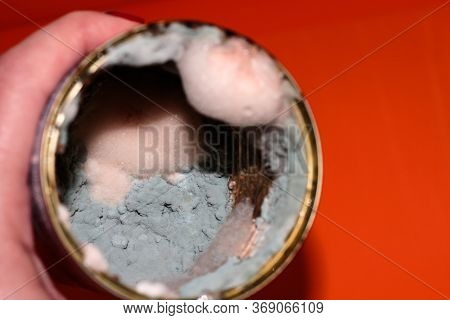 In The Hand Of The Bank With The Spoiled Food. Food With Mold. Delayed Goods. Poisonous Food.