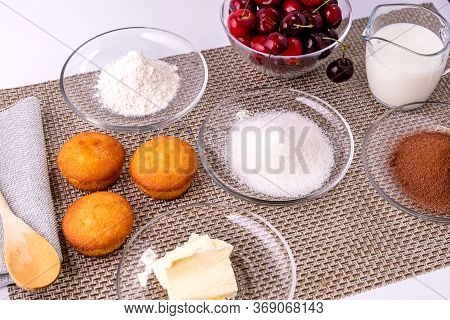 Ingredients For Making Homemade Cupcakes With Chocolate And Cherries. Classic Recipe For Making Dess