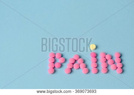 Pink Round Pills Forming The Word Pain