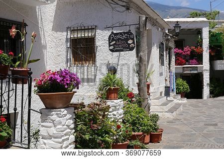 Capileira, Andalucia, Spain - May 29, 2019: Many Flowers In Flower Pots On The Street Of Capileira S