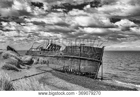 Wreck of Amadeo steamship build in 19th century in United Kingdom is since 1932 beached near Estancia San Gregorio, Chile. Black and white