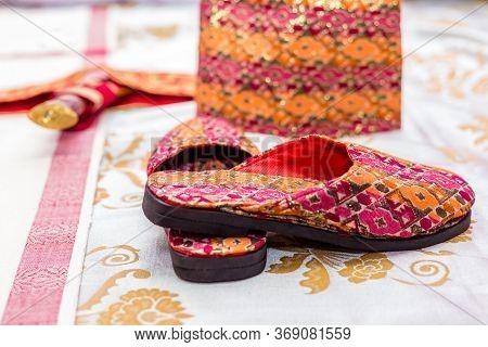 Nepali Groom's Wedding Day Accessories Sandals,khukuri Knife,dhaka Topi Cap.selective Focus