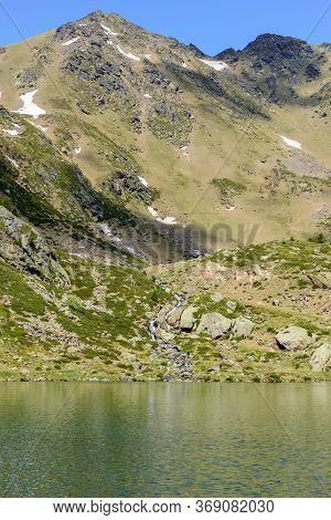Beautiful View Hiking In The Andorra Pyrenees Mountains In Ordino, Near The Lakes Of Tristaina.