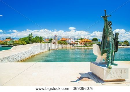 Croatia, Town Of Nin, Old Stone Bridge And City Gates With Monument Of Medieval Croatian Ruler