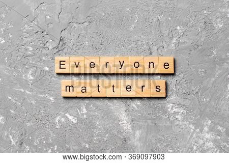 Everyone Matters Word Written On Wood Block. Ever Yone Matterstext On Cement Table For Your Desing, 