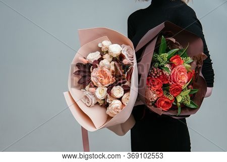 Bouquet Of Flowers In Burgundy Package And Bouquet Of Flowers In Peach Foamiran Package In The Hands