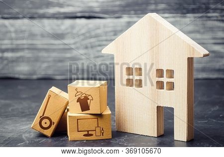 House And Boxes With Delivered Ordered Goods. Reorientation Of Business To Online Services And Netwo