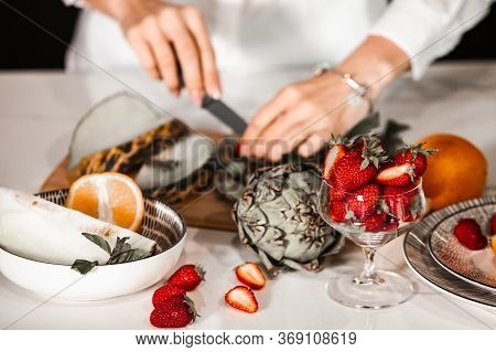 Closeup On Woman Making Fruits Salad. Preparing A Healthy Spring Fruit Salad. Happy Healthy Woman Cu