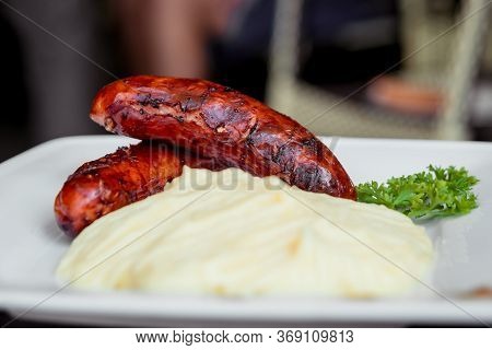 Potatoe With Sousages On The White Plate