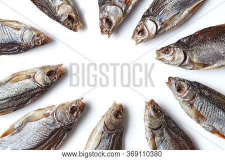 Jerky Or Dried Salted Roach Laid Out In Circle, Delicious Clipfish Isolated On White Background. Sal