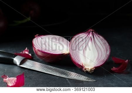 Red Onion. Large Onion And Sliced. Black Background. Side View. Red Onions On Old Crumpled Burlap. C