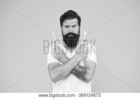 No Toothache. Bearded Man Hold Toothbrushes. Hipster With Tooth Brushes. Teeth Care. Oral Hygiene. D