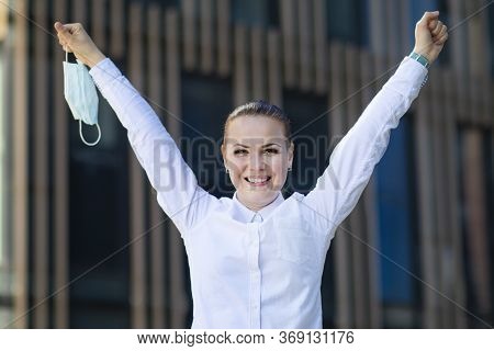 Happy Positive Girl, Young Beautiful Woman, Businesswoman Takes Off Protective Sterile Medical Mask 