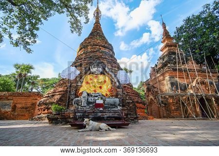 Buddha Statue In Old Temple In Inwa (ava) Near Mandalay In Myanmar (burma). Southeast Asia Travel Co