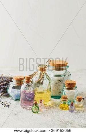 Aromatic Oils In Glass Bottles, Aromatic Salts And Dry Lavender. Concept Natural Ogranic Skincare Co