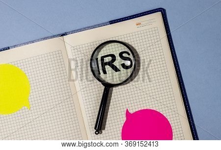 Irs Acronym Text Written On A Notebook Or Planner Through Loupe Magnifying Glass. Tax Reminder. Reve