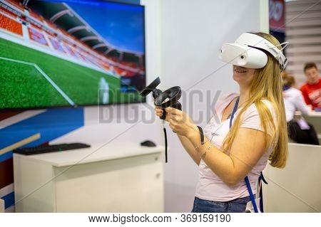 Moscow, Russia - October 04, 2019: Young Caucasian Girl In Dell Visor Windows Mixed Reality Headset 
