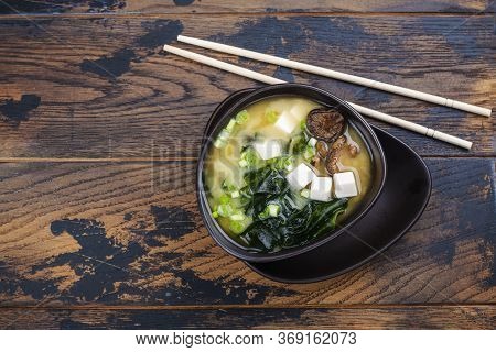 Japanese Traditonal Miso Soup With Wakame Seaweeds, Tofu And Shiitake Mushrooms On Bamboo Mat. Copy 