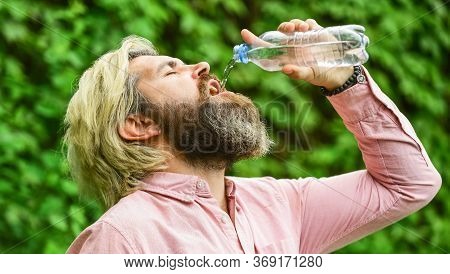 Clear And Fresh. Bearded Mature Man Drinking Water. Fresh And Healthy Water From Bottle. Healthcare 