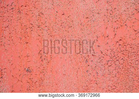 Old Orange Painted Crumbling Wall. Background Of Wall Covered With Crumbling Old Orange Paint. Old C